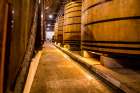 Oak vats and barrels, Real Companhia Velha winery and cellars, Gaia, Porto, Portugal. Art Print